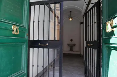 an entrance to a room with a green door at Pantheon Magic House in Rome