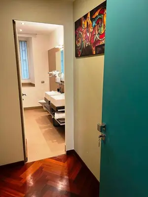 an open door to a bathroom with a sink at Dolce Vita Guest House in Rome