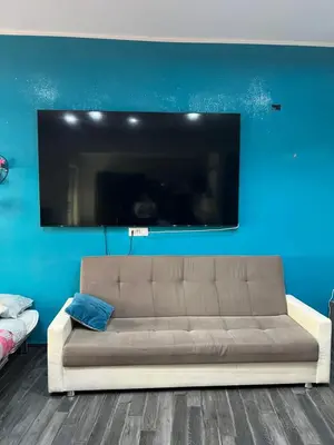 a living room with a couch and a flat screen tv at Nathan House,Teano in Rome