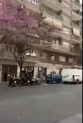a blurry picture of a building with cars and a tree at Appartamento Trastevere & Porta Portese grande in Rome