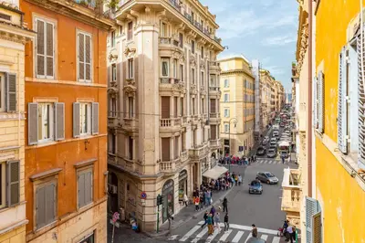 a view of a city street with buildings at Barberini 3 BDR Apartment in Rome