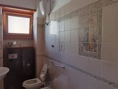 a bathroom with a toilet and a sink at Appartamento per Turisti e Famiglie Roma in Rome