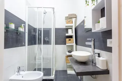 a bathroom with a shower and a toilet and a sink at Holiday Homes Rome - Portuense 21 - Family Studio in Rome
