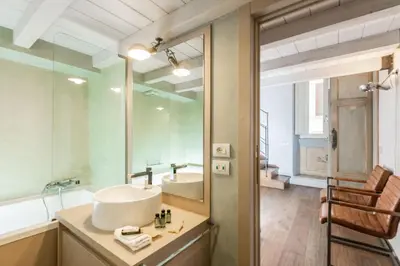 a bathroom with a sink and a mirror at Design apt near Spanish Step in Rome