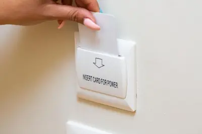 a person pressing the next upgrade button on a lightswitch at Iron Cityaus Termini in Rome