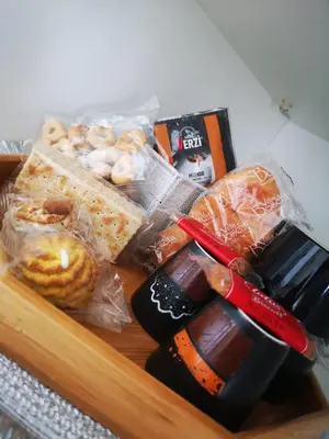 a tray filled with different types of food at Emperooms Guest House in Rome
