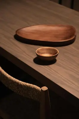 two wooden bowls sitting on top of a wooden table at The Sanctuary Urban Retreat in Rome