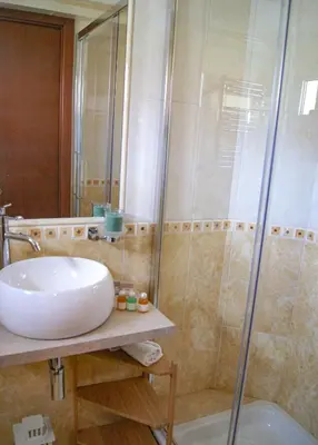 a bathroom with a sink and a shower at Esposizione Boutique in Rome