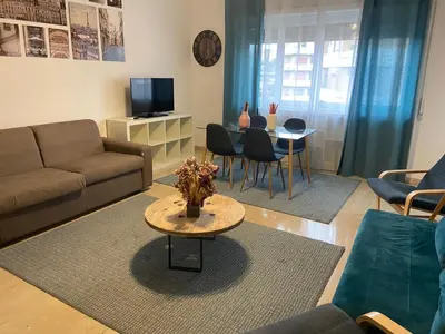 a living room with a couch and a table at Gregorio VII Vatican House in Rome