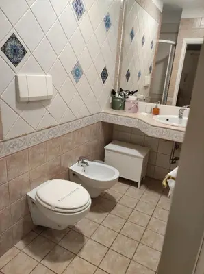 a bathroom with a toilet and a sink at Home in Trastevere Testaccio in Rome