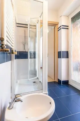 a bathroom with a shower and a sink at Gregorio VII - Deliziosa sistemazione a due passi da San Pietro in Rome