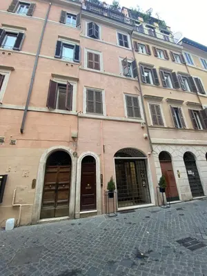 a large brick building with doors and windows at sweet home Laurina in Rome