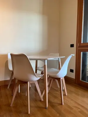 a table and two chairs in a room at Mary's house in Rome