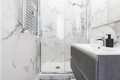 a bathroom with a shower and a sink at Amazing apartment near to Colosseo and subway in Rome
