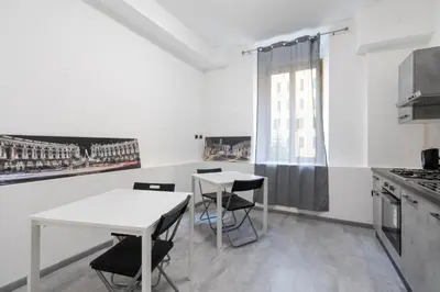 a kitchen with a table and chairs and a window at Amazing apartment near to Colosseo and subway in Rome
