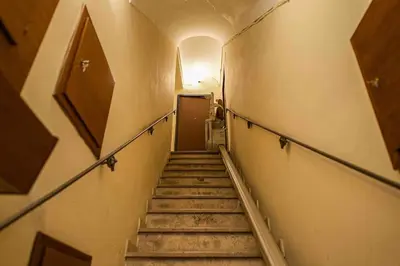 a hallway with stairs in an old building at Anna’s Crazy Place in Rome
