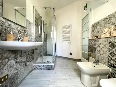 a bathroom with a sink and a toilet and a shower at Vatican Home Holidays in Rome