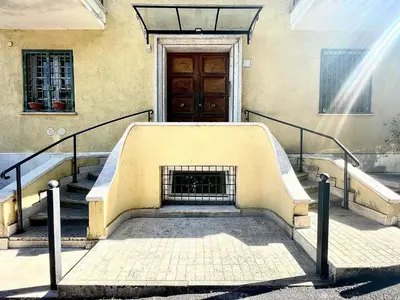 a set of stairs in front of a building with a door at Vatican Home Holidays in Rome