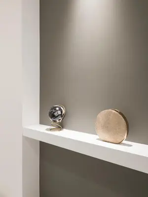 a shelf with two objects on top of it at Savoia Rooms Roma in Rome