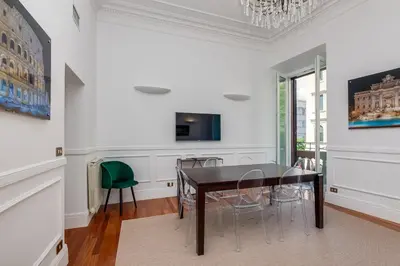 a dining room with a table and chairs at Aletheia Èlite - Elegant 2 BR in Rome