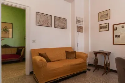a living room with a couch and a table at GuestHost - San Giovanni in Laterano Comfy Apartment in Rome