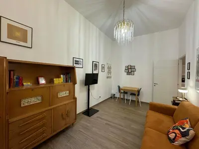 a living room with a couch and a table at Casa Marin - Metro Malatesta in Rome