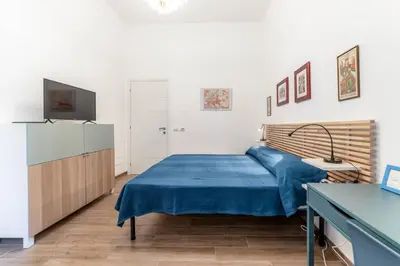 a bedroom with a bed and a television in it at Casa Marin - Metro Malatesta in Rome