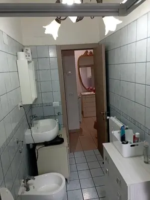 a bathroom with a sink and a toilet at Pigneto House in Rome