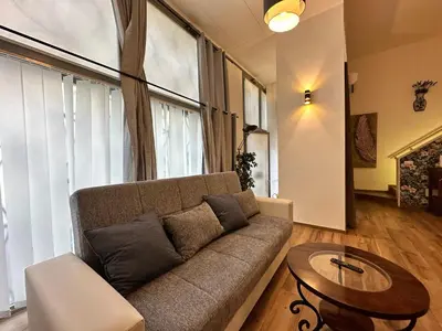 a living room with a couch and a table at Relais Romagnosi in Rome