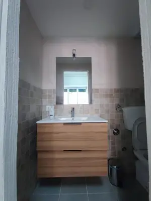 a bathroom with a sink and a mirror at Style House 74 in Rome