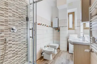 a bathroom with a toilet and a sink at My Sweet R-home in Vatican in Rome