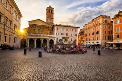 a city square with a clock tower and a building at Nannì Vatican House in Rome