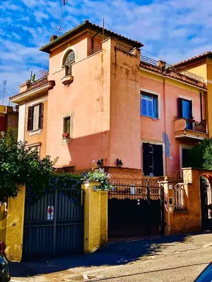 a building with a gate in front of it at La Casetta di San Giovanni 1924 in Rome