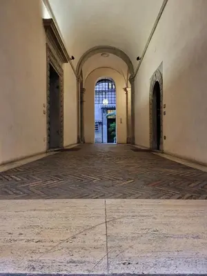 an empty hallway in an old building with a door at The Rabbit Hole in Rome