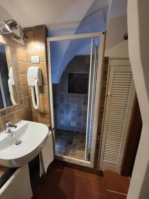 a bathroom with a sink and a shower at The Rabbit Hole in Rome