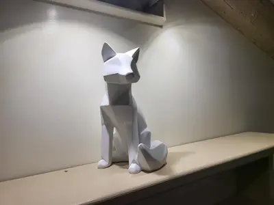 a sculpture of a cat sitting on a shelf at The Fox Cove in Rome