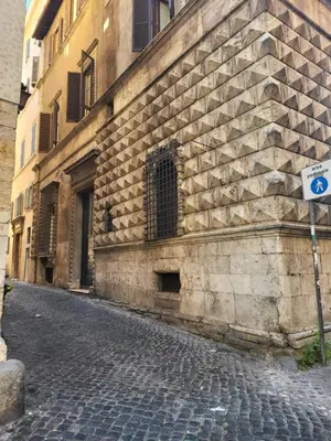 a stone building with a street sign in front of it at The Fox Cove in Rome