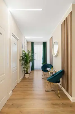 a hallway with two chairs and a table at AlbaDea Deluxe in Rome