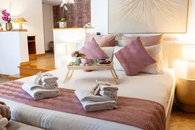 a bedroom with a bed with towels on it at MB SUITES Margutta in Rome