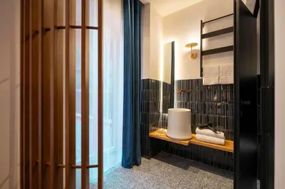 a bathroom with a sink and a toilet in a room at Palazzetto Symphony in Rome