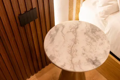 a table in a room next to a bed at Palazzetto Symphony in Rome