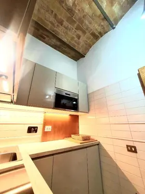a kitchen with a sink and a microwave at 1878s by SC LUXURY HISTORIC HOUSE PIAZZA DI SPAGNA in Rome