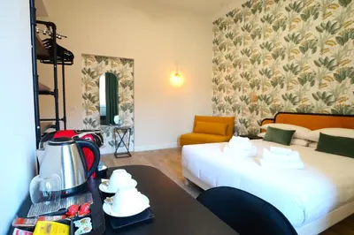a hotel room with a bed and a coffee maker on a table at San Cosimato 40 guesthouse in Rome