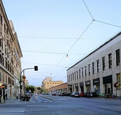 an empty city street with buildings and a traffic light at PORTA MAGGIORE 9 ROMA Locazione Turistica in Rome