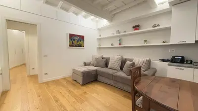 a kitchen and dining room with a table and chairs at suity I cozy leutari 23 in Rome