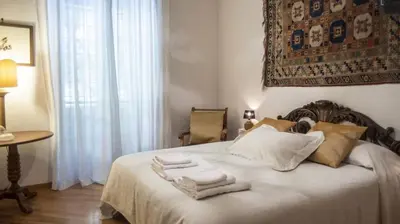 a bedroom with a bed with towels on it at Foscari Holiday House in Rome