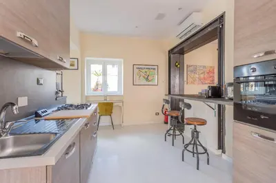 a kitchen with a sink and a counter top at the B rooftop apartment in Rome