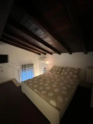 a bedroom with a large bed in a room at Residenza Morlupo (Fleming) in Rome