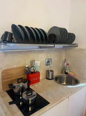 a kitchen counter with pots and pans on a stove at Residenza Morlupo (Fleming) in Rome