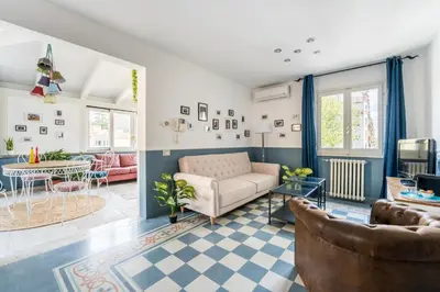 a living room with a couch and a table at Elizabeth Penthouse, Charmy Apartment in Little London 10 Min From the Center in Rome